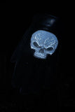 Nighttime view of reflective skulls on men's leather motorcycle gloves