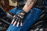 Rider wearing Daniel Smart Mfg. sporty leather fingerless motorcycle gloves with hard knuckles