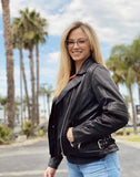 Woman wearing lightweight leather motorcycle jacket showing front