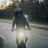 Rider wearing Gloss Black Glide model modular motorcycle helmet with smoke shield