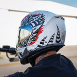 Motorcycle rider wearing Glide model modular motorcycle helmet with Phoenix graphics