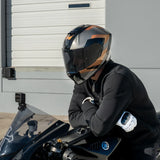 Rider wearing Viper model full face motorcycle helmet with Copperhead graphic