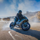 Rider wearing gloss black Detour model full face motorcycle helmet